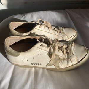 Golden Goose Superstar white and gold sneakers